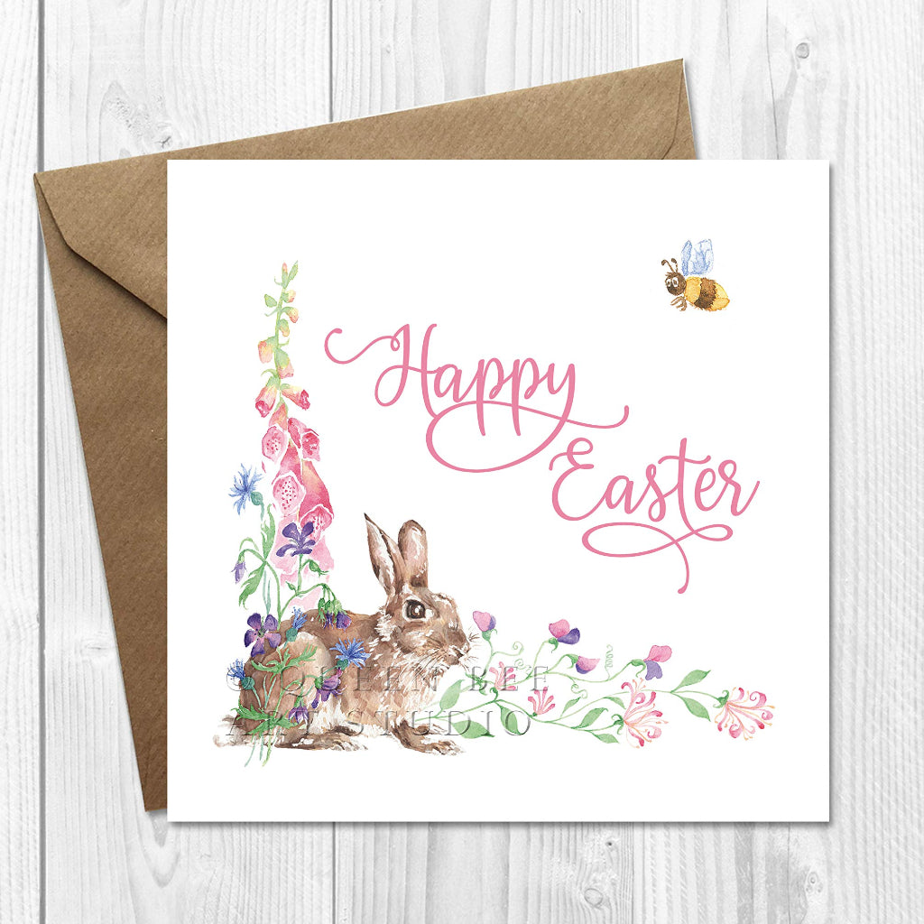 Pretty Happy Easter card with realistic bunny rabbit and pink spring flowers on the front.