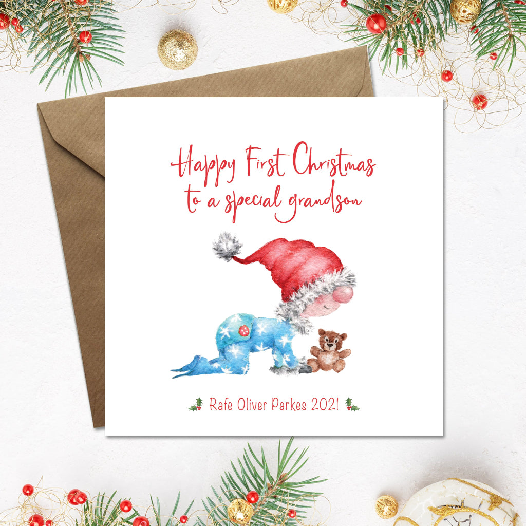 1st Christmas card for a special grandson with a baby boy gnome and teddy bear, surrounded by festive decorations.