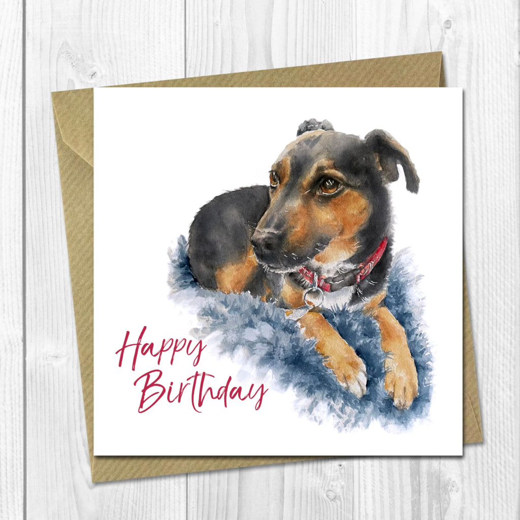 birthday card with painting of black & tan terrier sitting on blue cushion