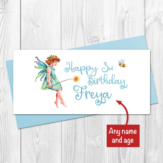 Personalised fairy birthday money wallet card with pale blue envelope on wooden background