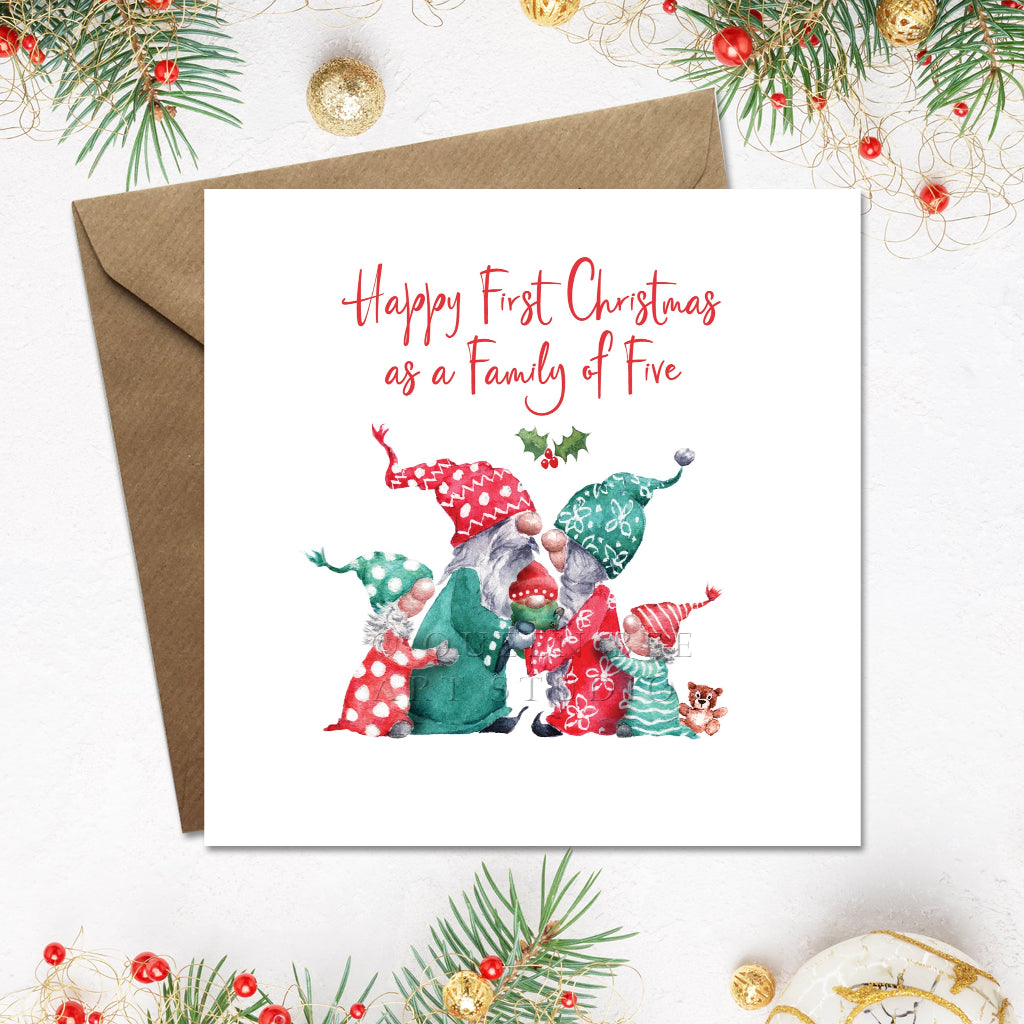 Happy 1st Christmas card with cute gnome family of 5 and envelope on a festive background