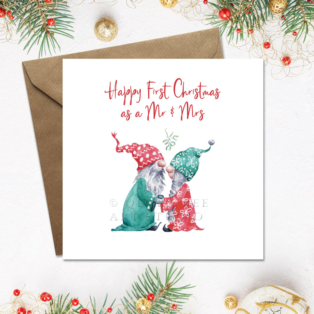 Christmas card with two gnomes and 'Happy First Christmas as a Mr & Mrs' text, surrounded by festive decorations.