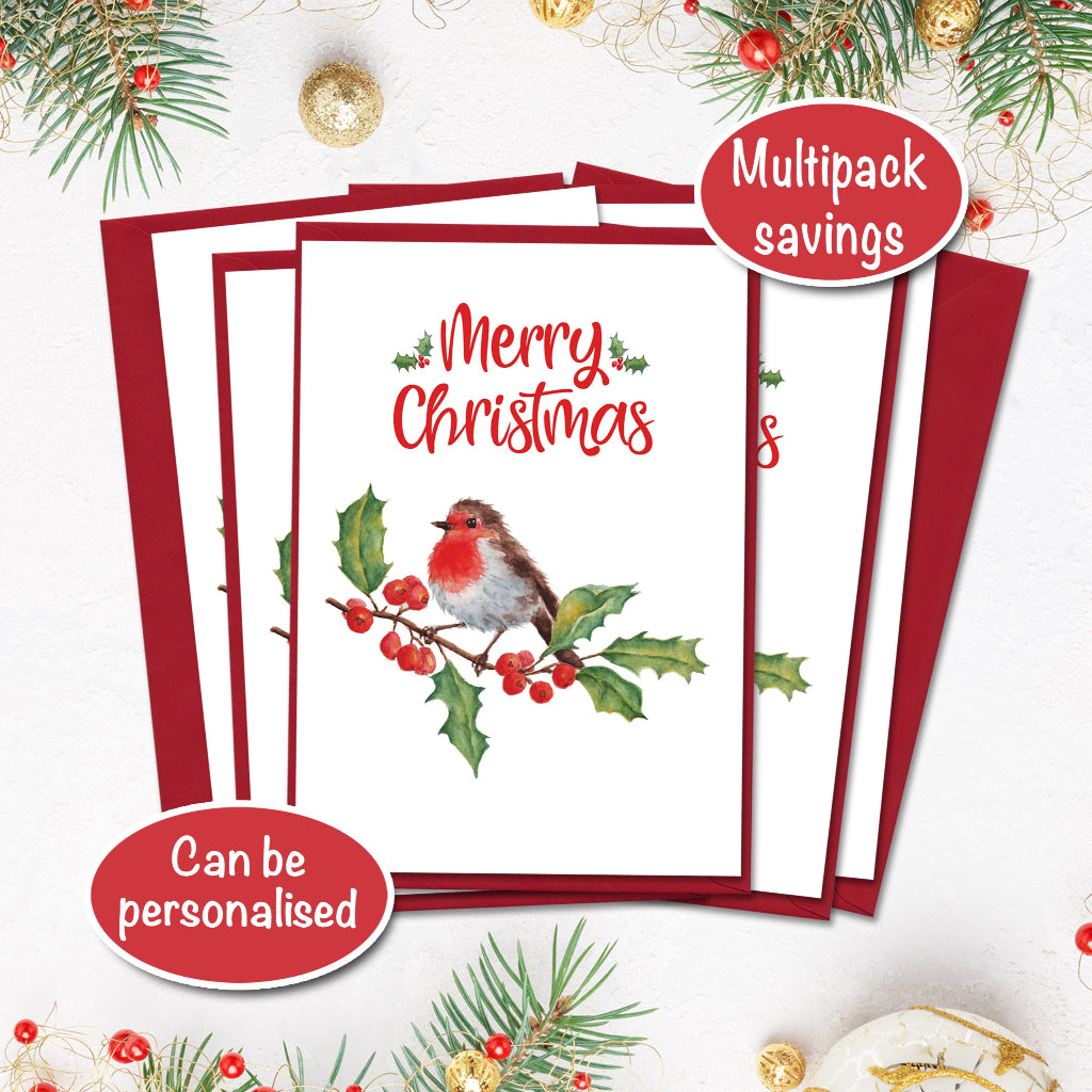 Set of Christmas cards with a robin design and red envelopes with multipack savings, surrounded by festive decorations.