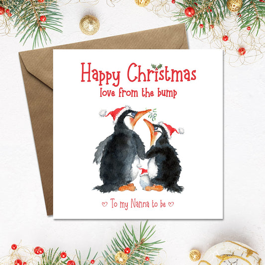 Sweet happy christmas card with love from the bump, personalised on the front to nanna or grandmother. Cute xmas card has 2 penguins kissing with a little egg in a santa hat.