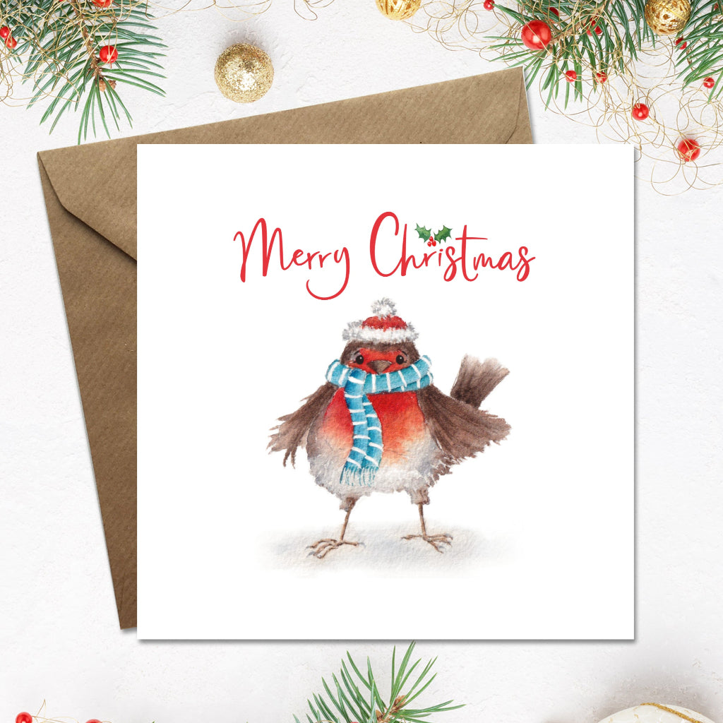 Merry Christmas card with a watercolour illustration of a fat fluffy robin in a santa hat and scarf