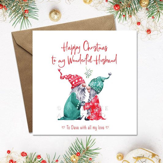 Cute Christmas card for husband with 2 sweet gnomes under the mistletoe. The card is personalised on the front with name and custom greeting.