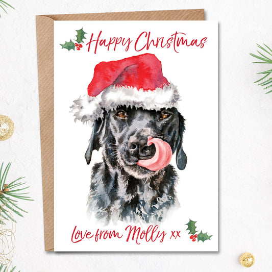 Personalised black labrador Christmas card from the dog. The front features a cute painting of a black lab licking her nose in a santa hat.