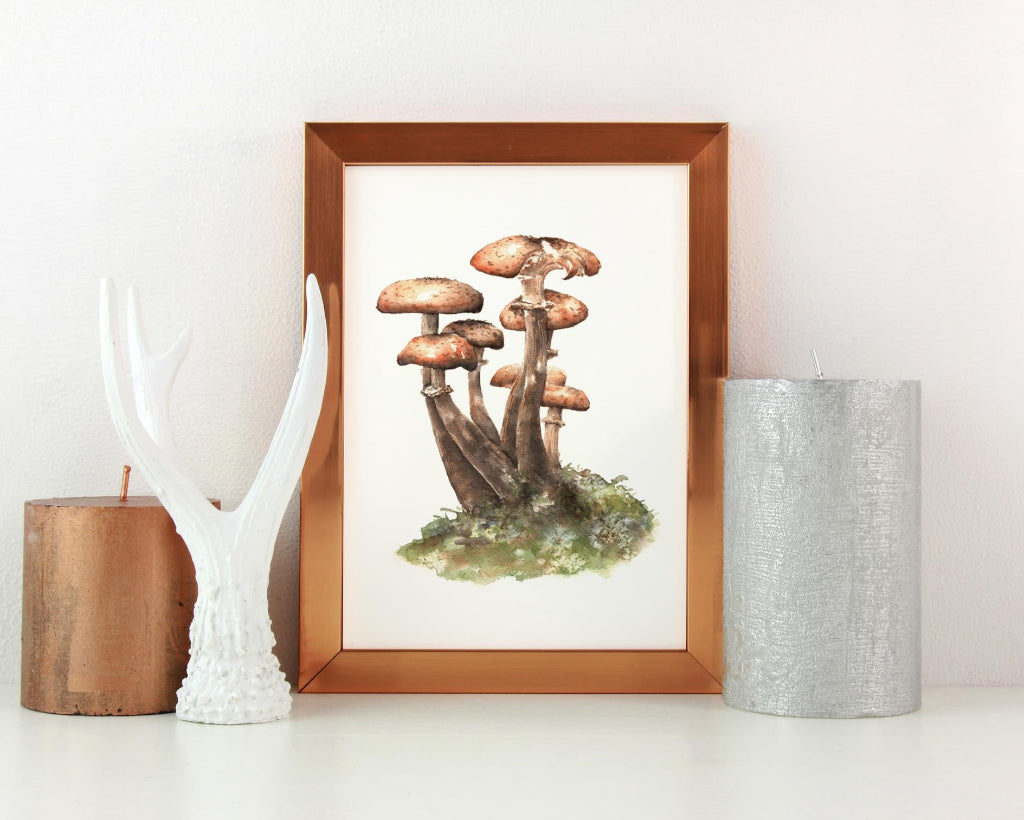 small brown mushroom watercolour print on mantelpiece with candles