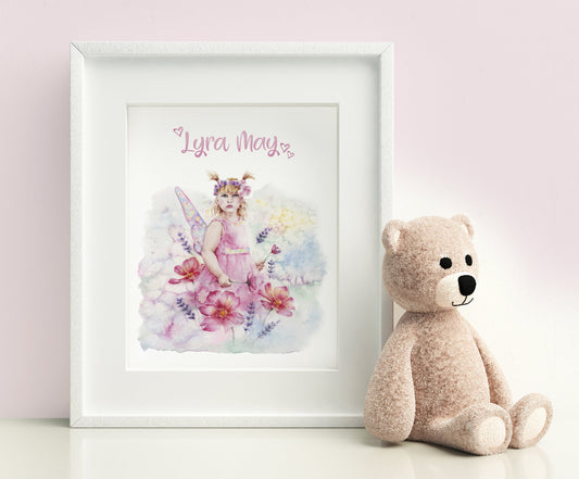 small framed personalised print wth a pink name with a blonde fairy in a pink dress in flowers