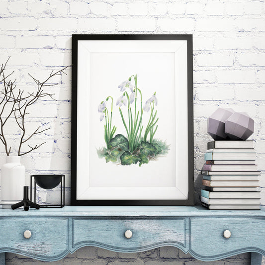 Large framed art print of snowdrops and ivy leaves in cottagecore rustic room setting