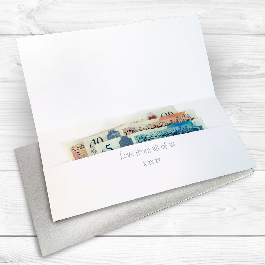 Money wallet card with cash inside on a white wooden surface, with a printed personalised message and silver envelope