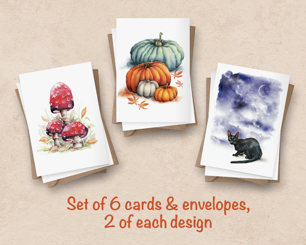 3 different halloween themed greeting cards, with red fairy toadstools, pumpkins and spooky black cat