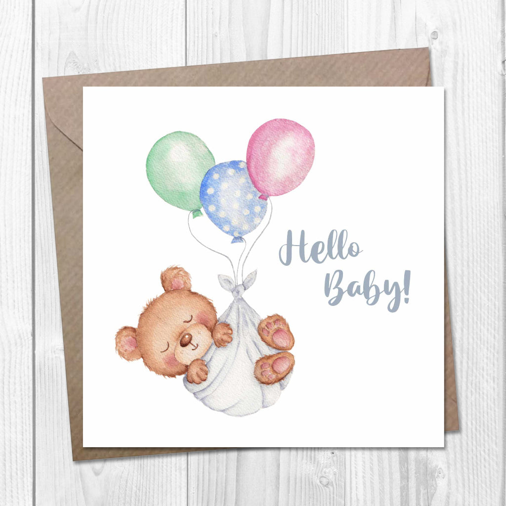 Greeting card with a teddy bear and balloons on a white background