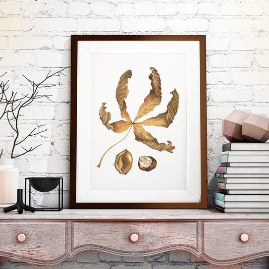 large framed picture of horse chestnut leaf in autumn colours in rustic cottagecore room setting