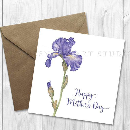 A floral Mother's Day card featuring a blue iris with the text 'Happy Mother's Day' on it, accompanied by a brown craft envelope.