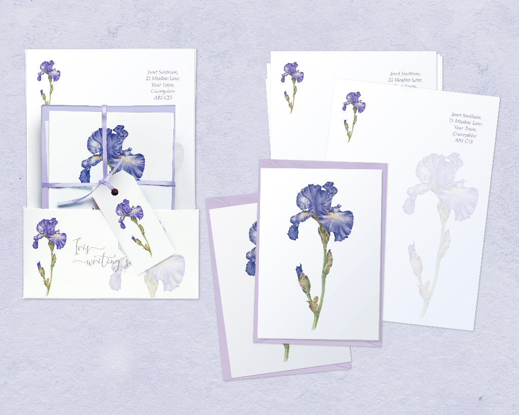 Contents of iris writing set with presentation gift wallet, ribbon and gift tag. Includes personalised writing paper, iris notelets and lilac envelopes