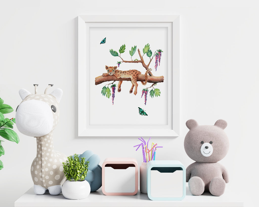 framed art print of a sleepy leopard in a tree in a jungle or safari themed nursery or playroom