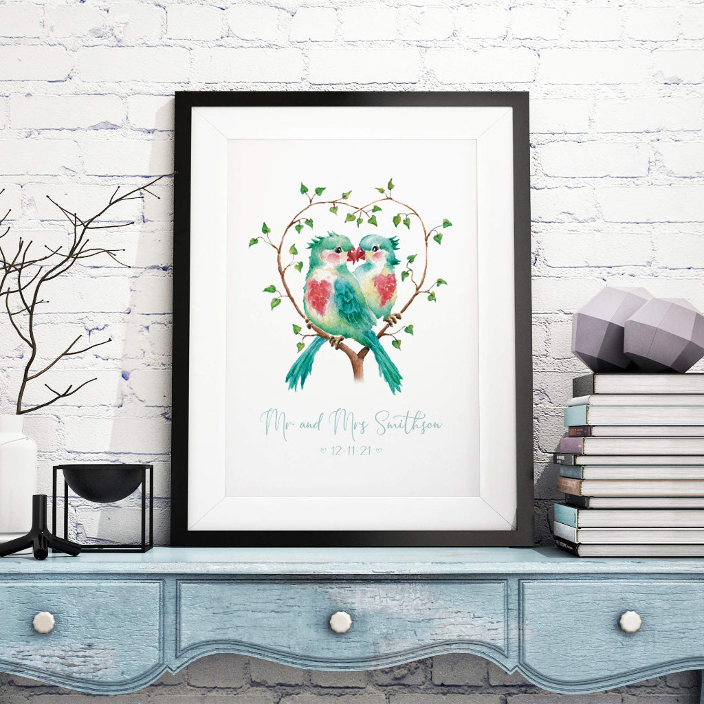 large framed picture of 2 lovebirds under a heart shaped bower, personalised with wedding date and Mr and Mrs names