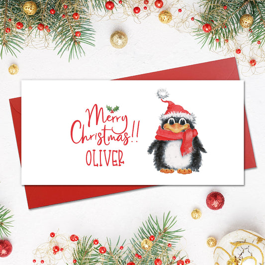 personalised christmas money wallet with a cute penguin in a santa hat and scarf with red envelope