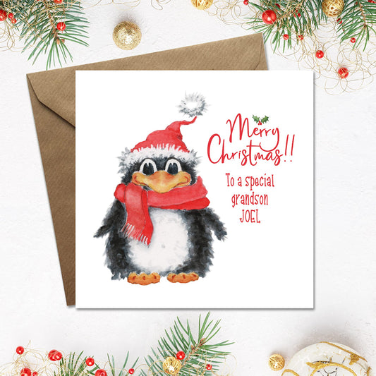 Merry Christmas card with a cute penguin in a scarf and santa hat, personalised with grandson's name, suitable for any relation 