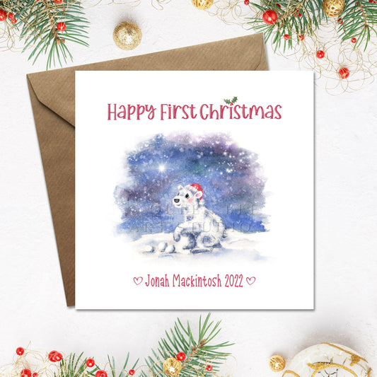 Christmas card with a baby polar bear and 'Happy First Christmas' text, personalised with name and year along bottom