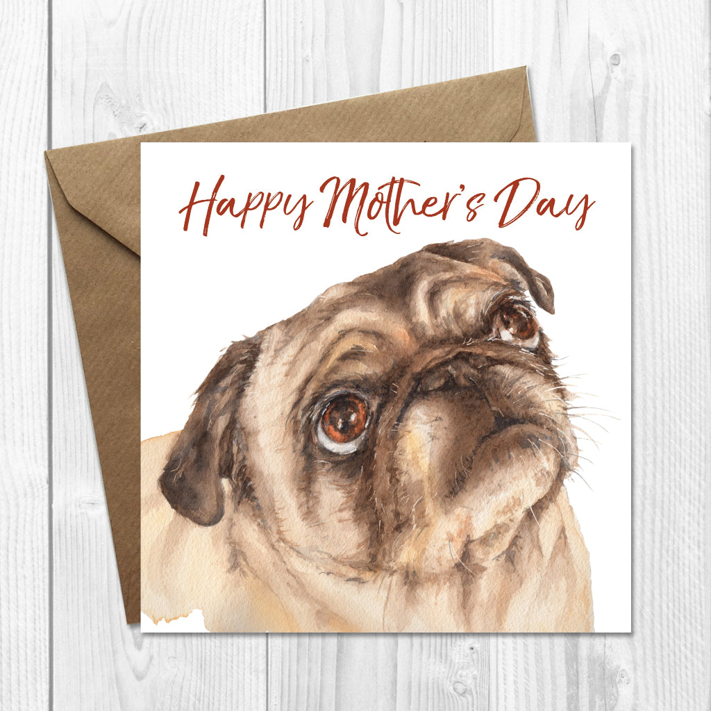 Mother's Day card with a pug illustration and 'Happy Mother's Day' text on a wooden surface.