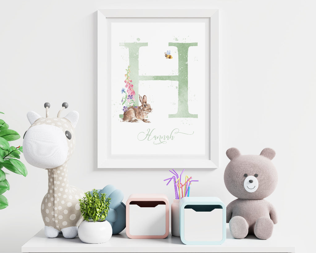 Big framed personalised print for baby girl with green initial letter, and small rabbit with woodland flowers