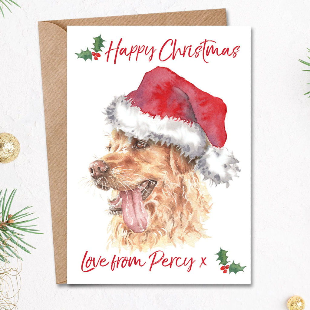 Personalised christmas card from the dog with a golden retriever in a santa hat on the front, with the dog's name printed along the bottom