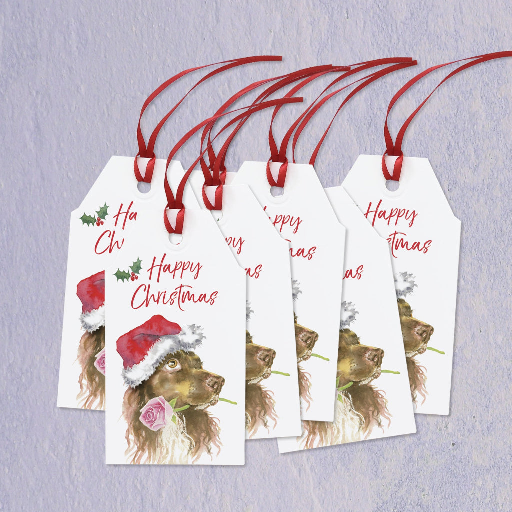 Set of 6 Christmas gift tags with an  illustration  of a cocker spaniel in a santa hat and 'Happy Christmas' text