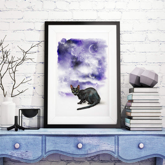 large framed picture of black cat in purple night sky with moon phase and stars on cupboard