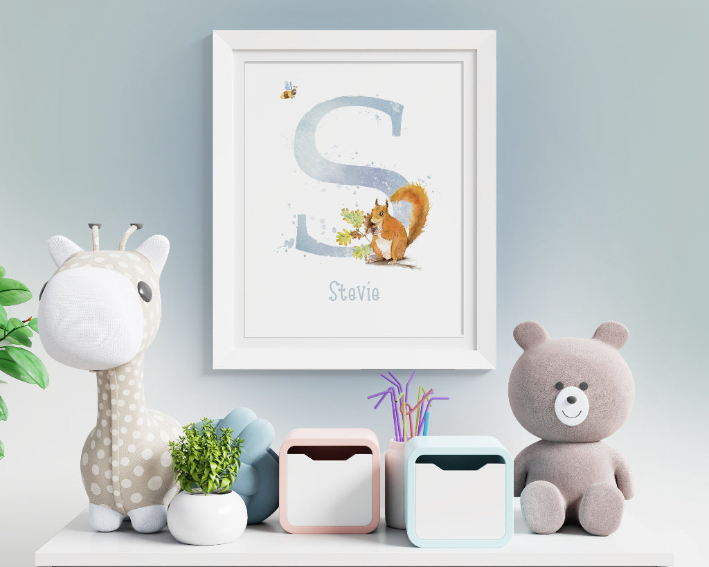 Cute framed personalised art print of red squirrel initial print in a child's nursery in duck egg blue
