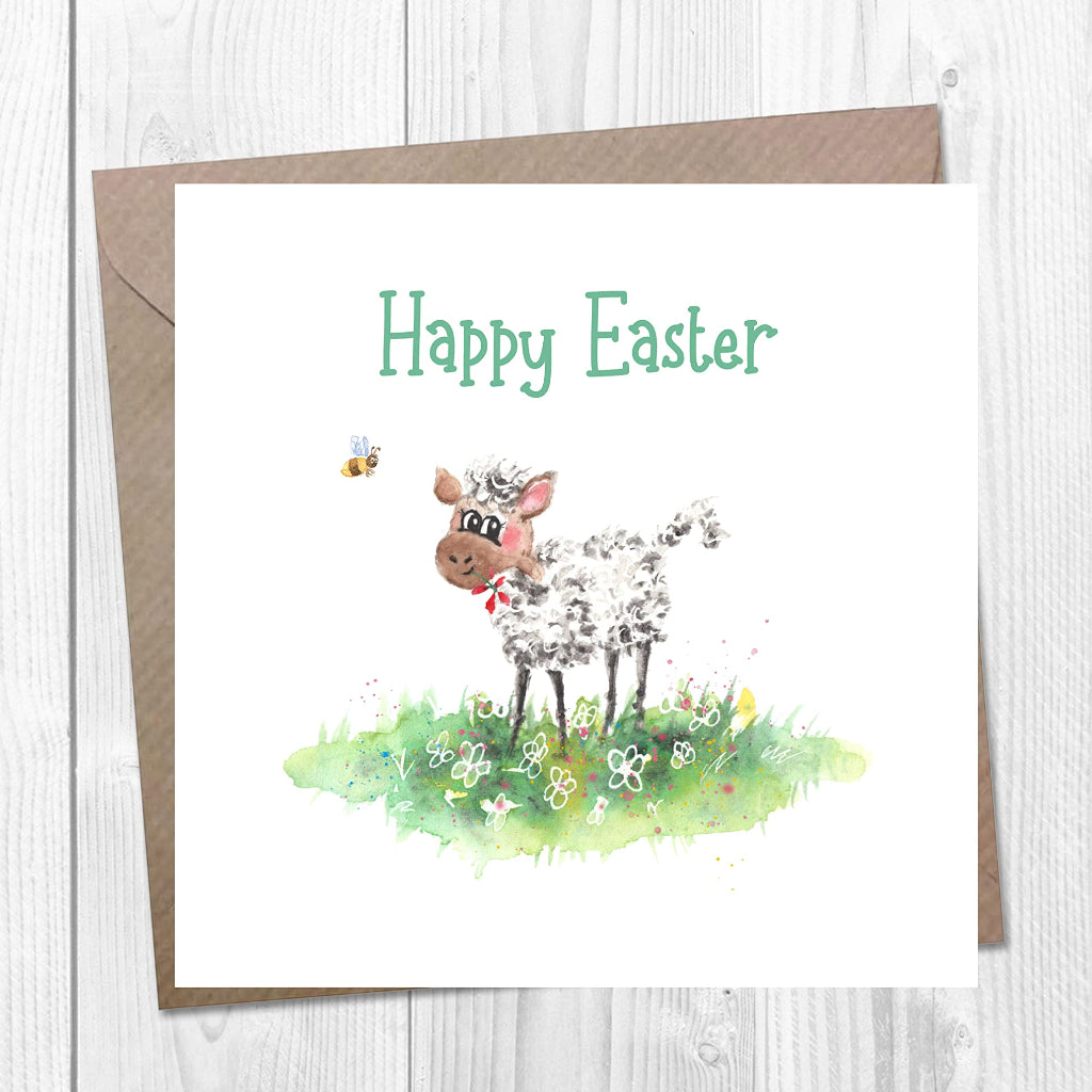 Easter card with an illustustration of a sweet lamb in a flower meadow