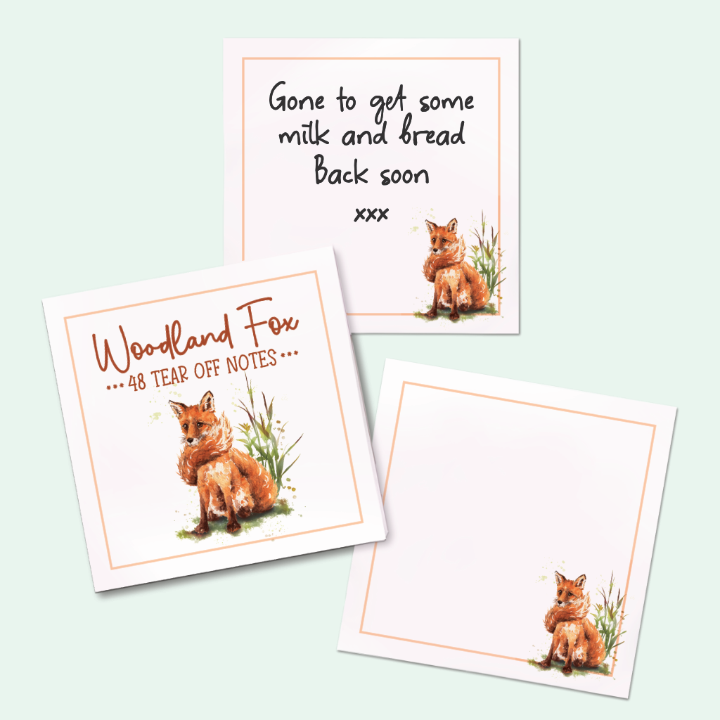 A woodland-themed note pad with tear-off notes displayed on a pale mint background. The notes feature watercolor fox illustrations, peach borders, and text showing "Gone to get Some Milk"